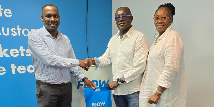 FLOW presents Sir Richie Richardson with smartphone