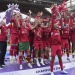 Liverpool players raise Premier League trophy in front of Klopp