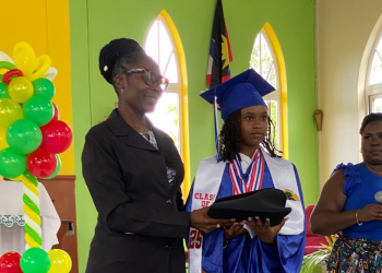 Community activist secures laptop for top performing student
