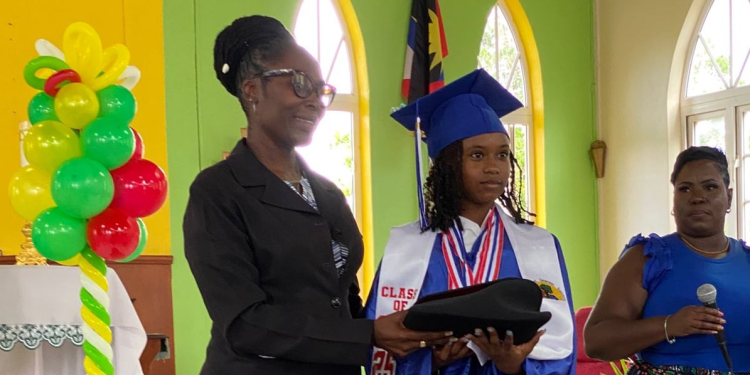 Community activist secures laptop for top performing student