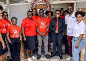 Caution J’ouvert makes timely donation to AIDS Secretariat